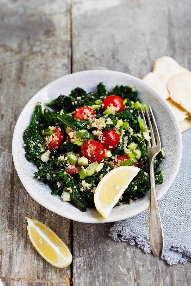Kale salad with quinoa and cherry tomatoes