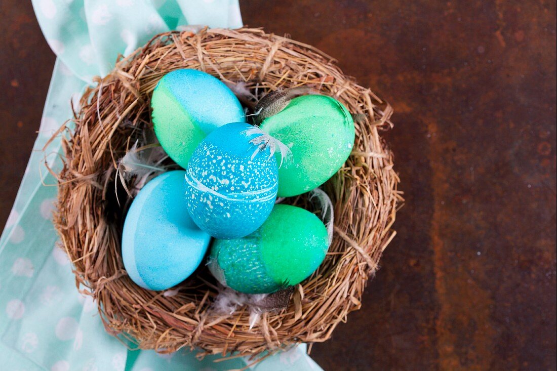 Dyed Easter eggs with batik patterns in a basket