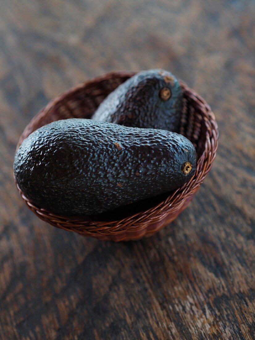 Two avocados in a basket (Italy)