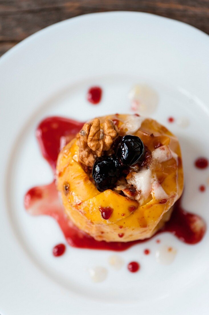 Baked apples for Christmas with nuts honey and cinnamon