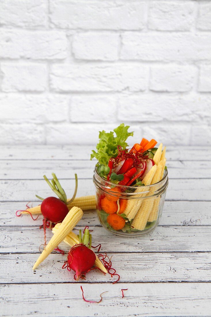 Healthy Vegan raw salad in a jar with space for text