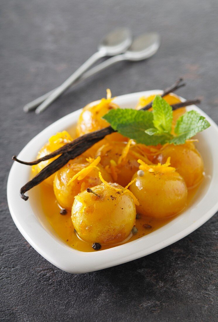 Yellow plums in orange honey with spices