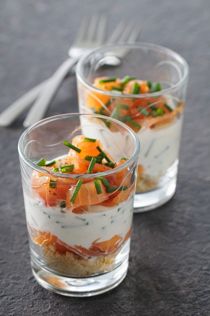 Savoury layered hors d'oeuvres with two types of salmon and chives
