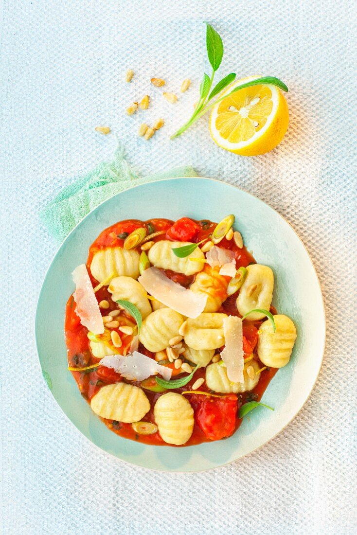 Gnocchi in tomato and lemon sauce with parmesan and pine nuts