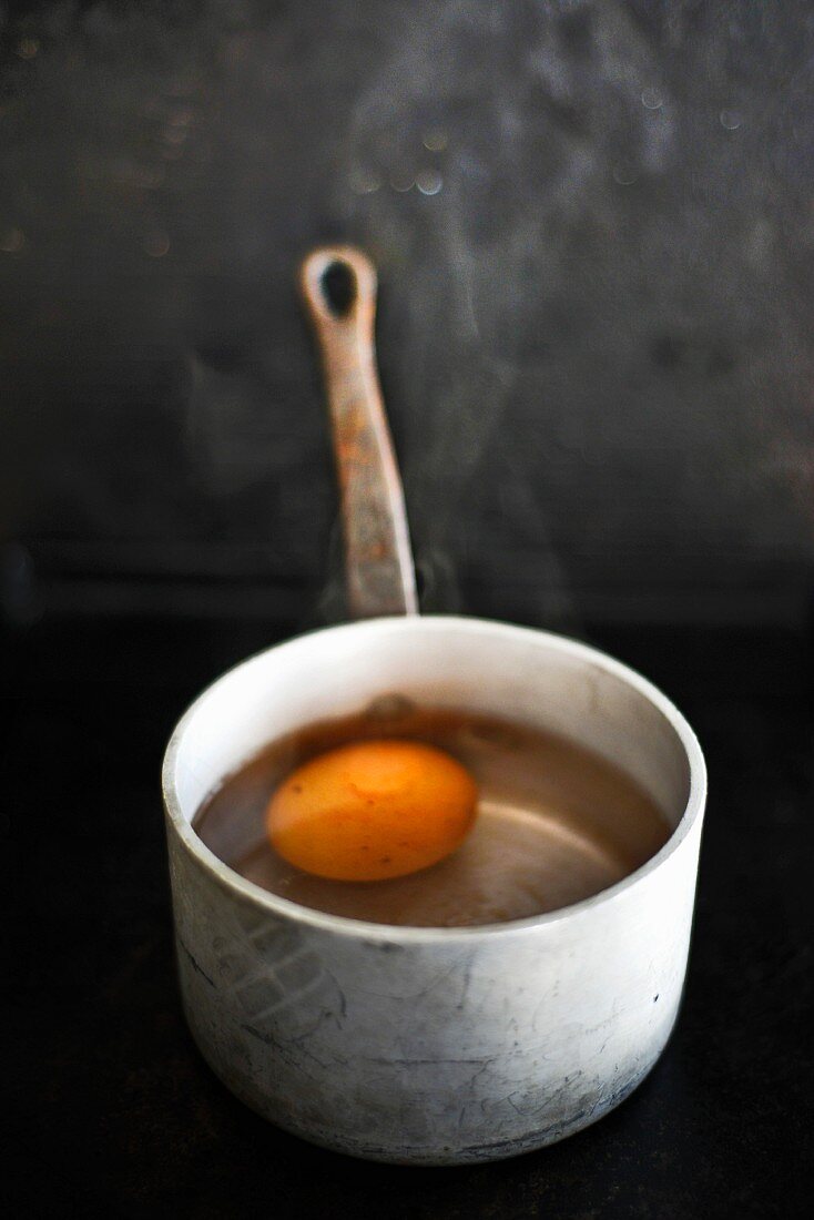 A hard-boiled egg in a saucepan