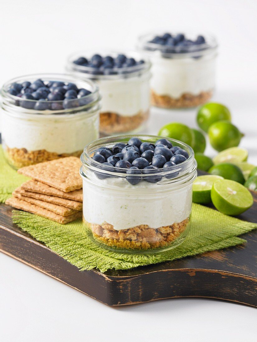 Key lime pie with blueberries in glasses (USA)