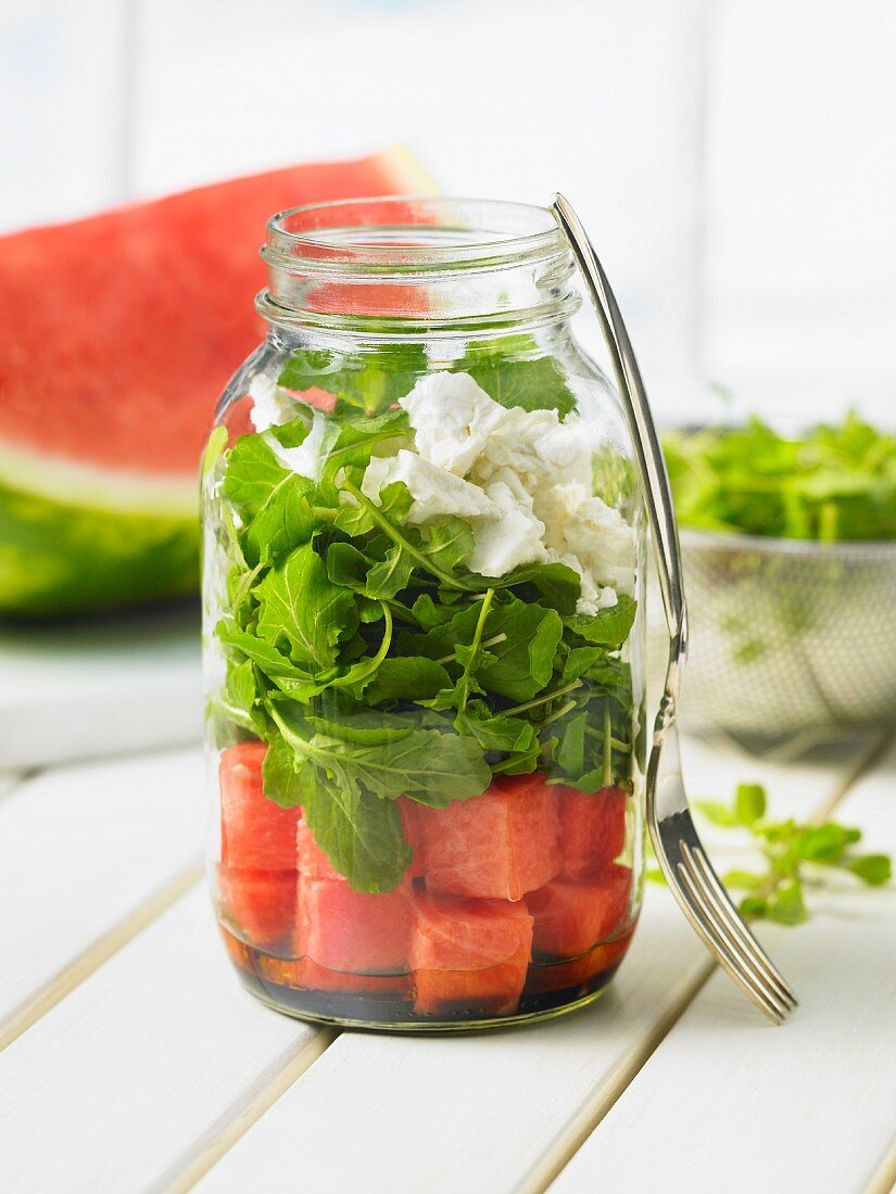 Layered salad with watermelon, rocket and feta