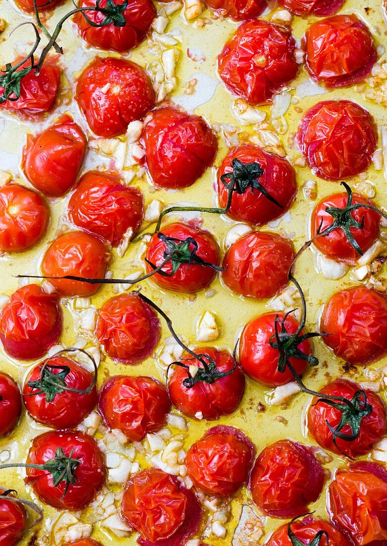 OVEN ROASTED GRAPE TOMATOES WITH GARLIC Oven roasted grape tomatoes with garlic