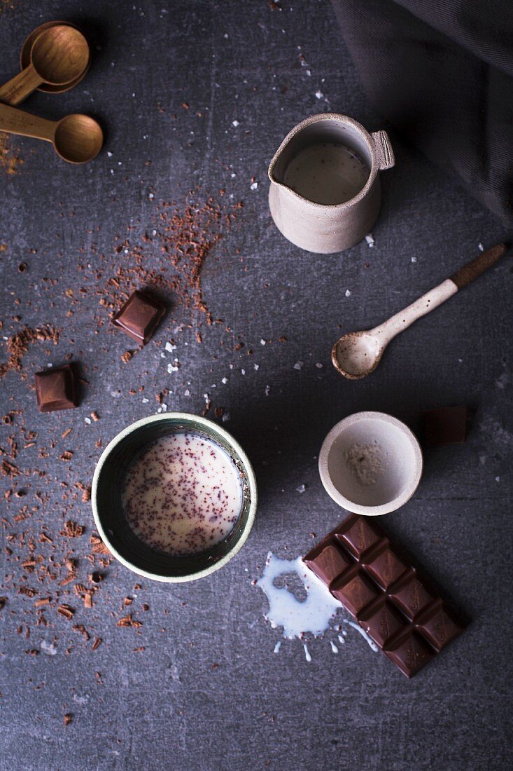 Hot chocolate with block of chocolate, milk cinnamon and sea salt