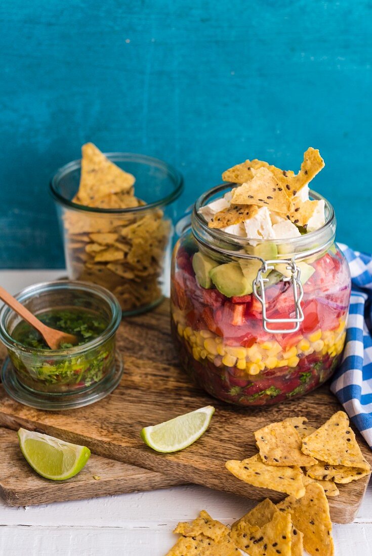 A Mexican bean salad with a honey and lime dressing in a glass jar