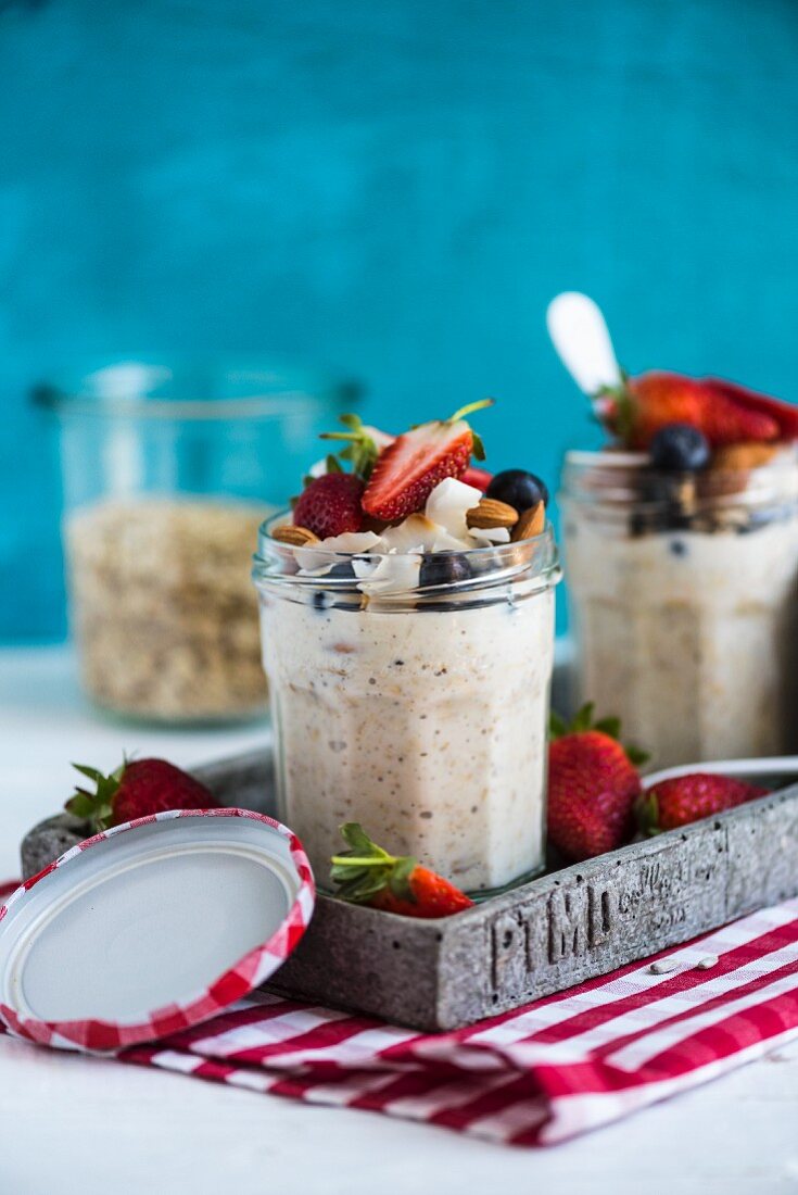 Overnight oats with fruit and nuts in a glass jar
