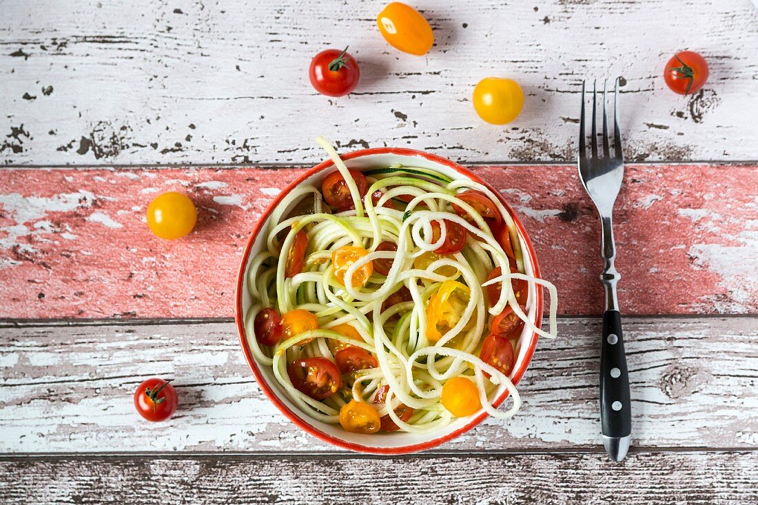 Zoodles (zucchini noodles) with tomatoes and basil