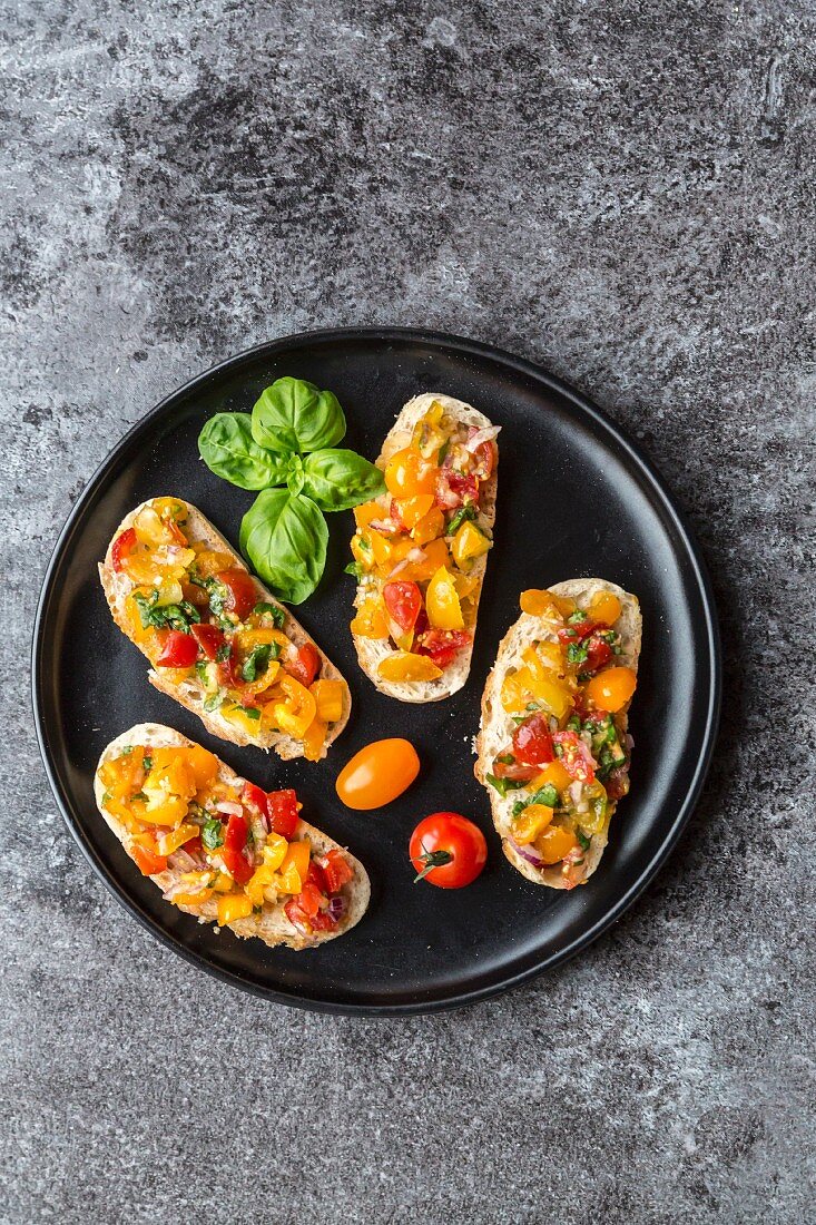 Bruschetta with colourful tomatoes and basil