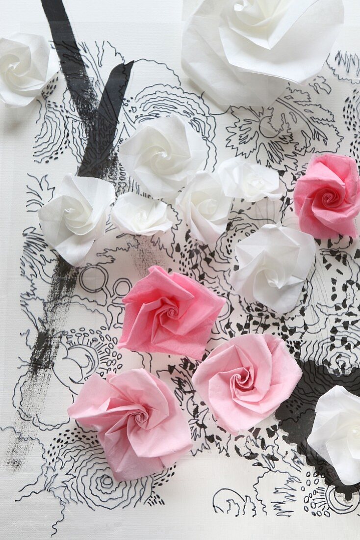 Paper roses on transparency with hand-drawn floral pattern