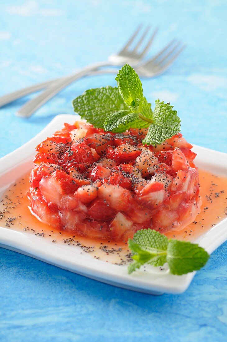 Strawberry tartare with poppy seeds and mint