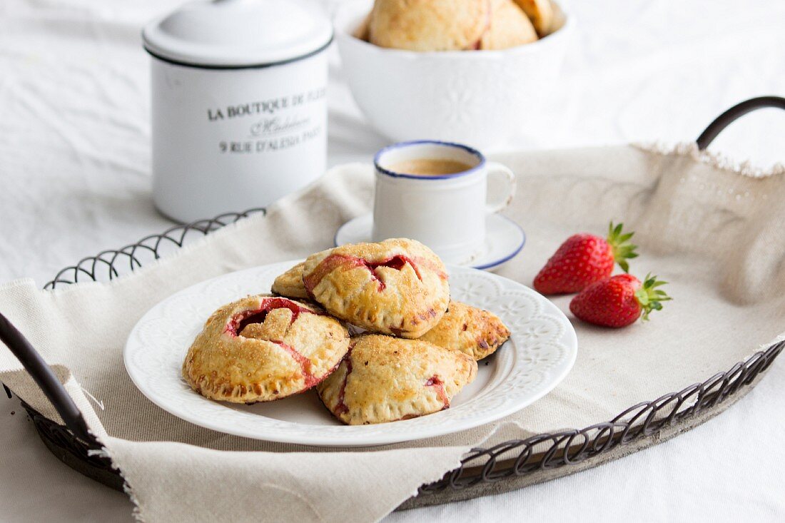 Hand pies (mini pies) with a strawberry filling and heart decorations