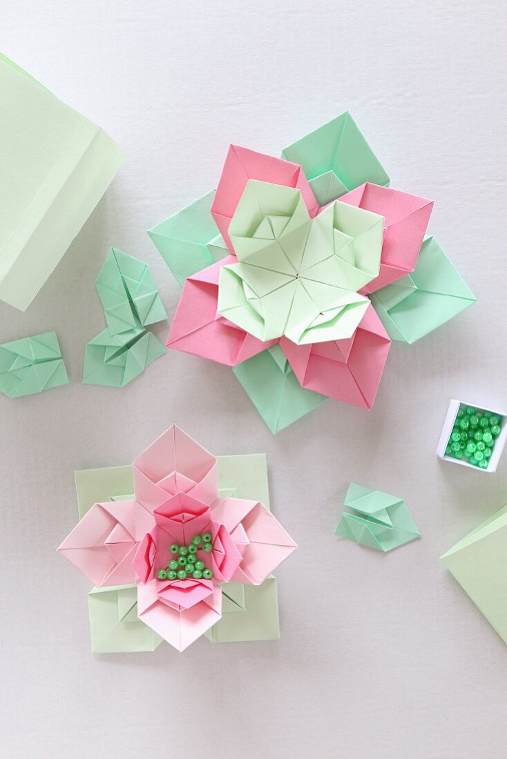 Origami flowers made from paper of various colours and beads