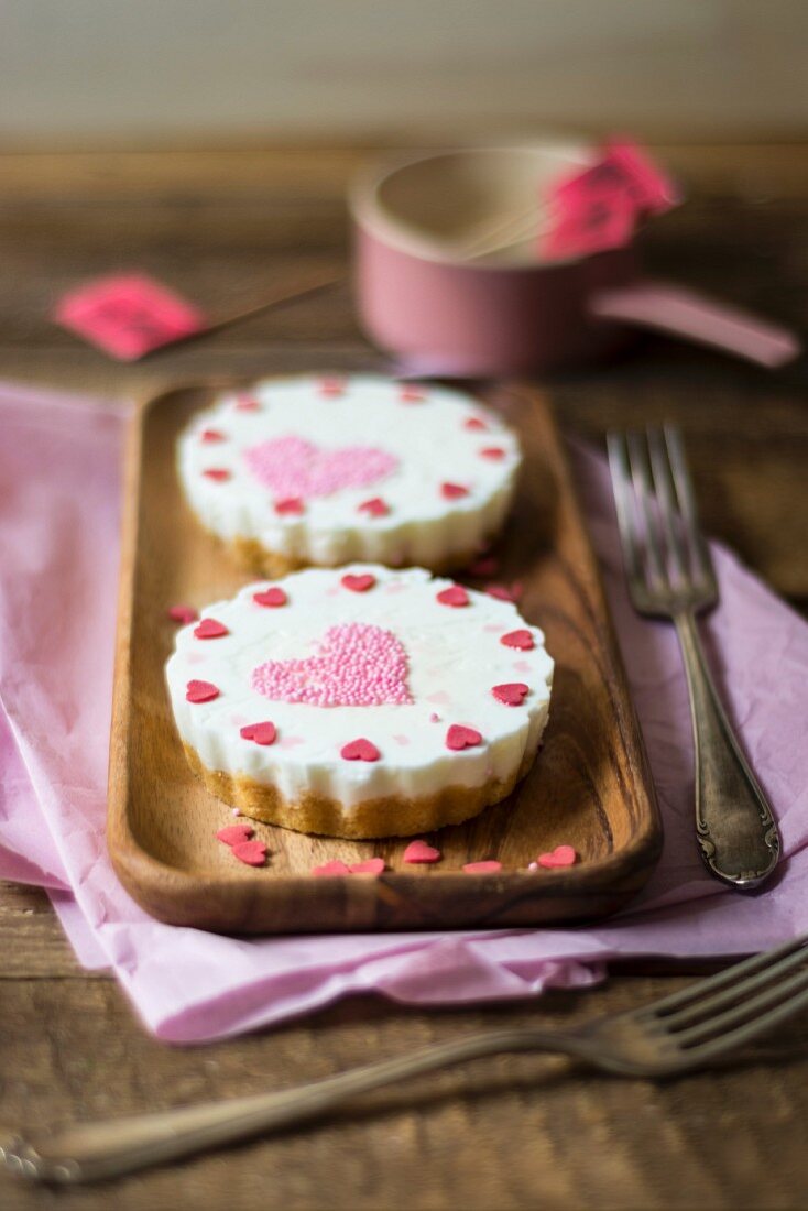 Yoghurt tartlets decorated with sugar hearts for Mother's Day