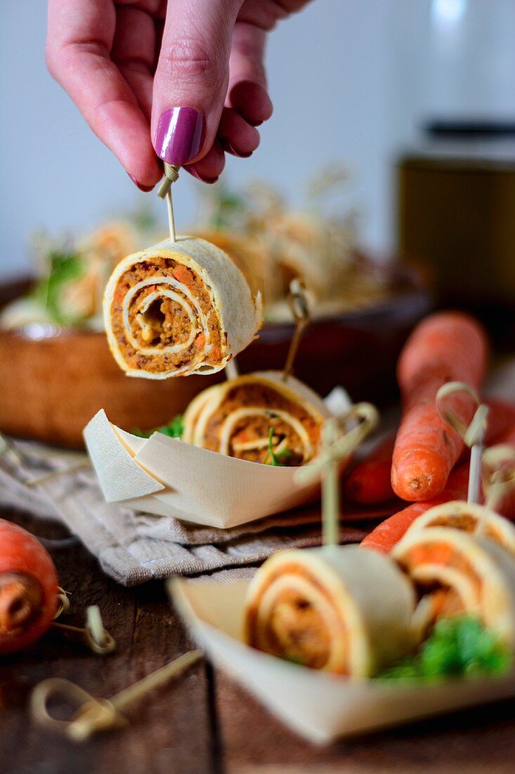 Vegan tortilla rolls with carrots on skewers