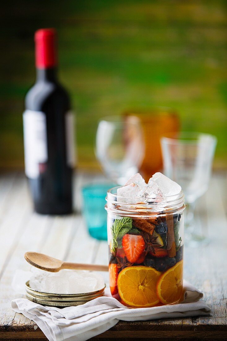 Ingredients for sangria in a glass jar
