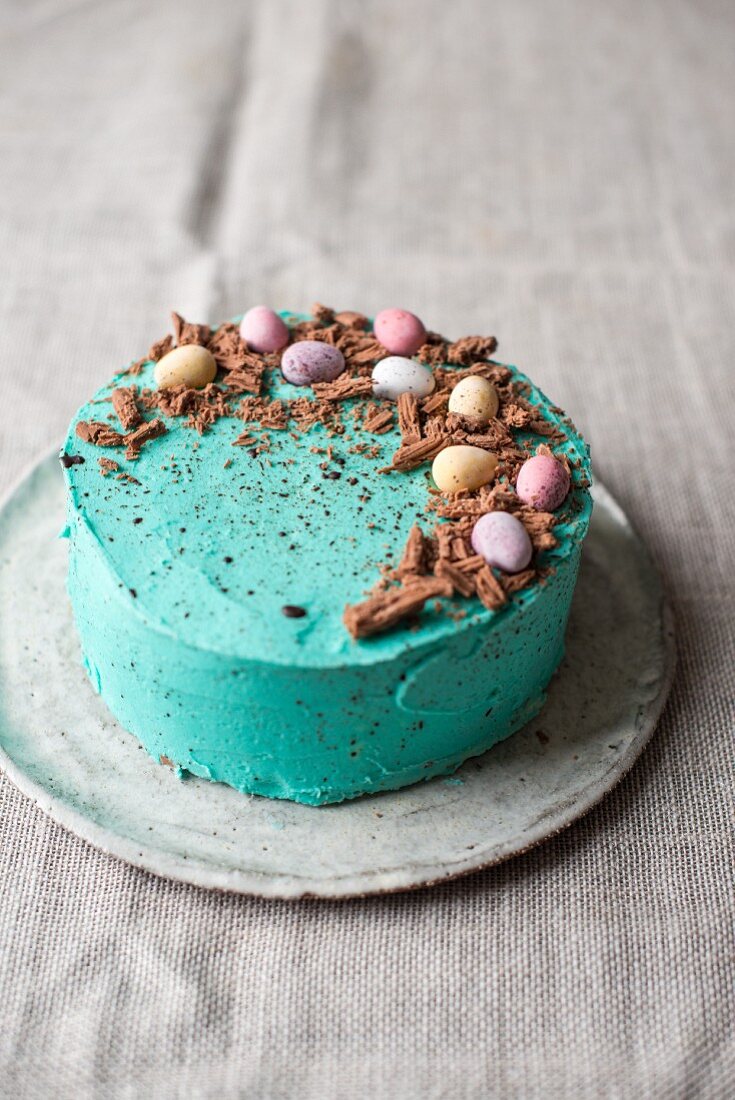 Easter cake with mini eggs and chocolate shavings
