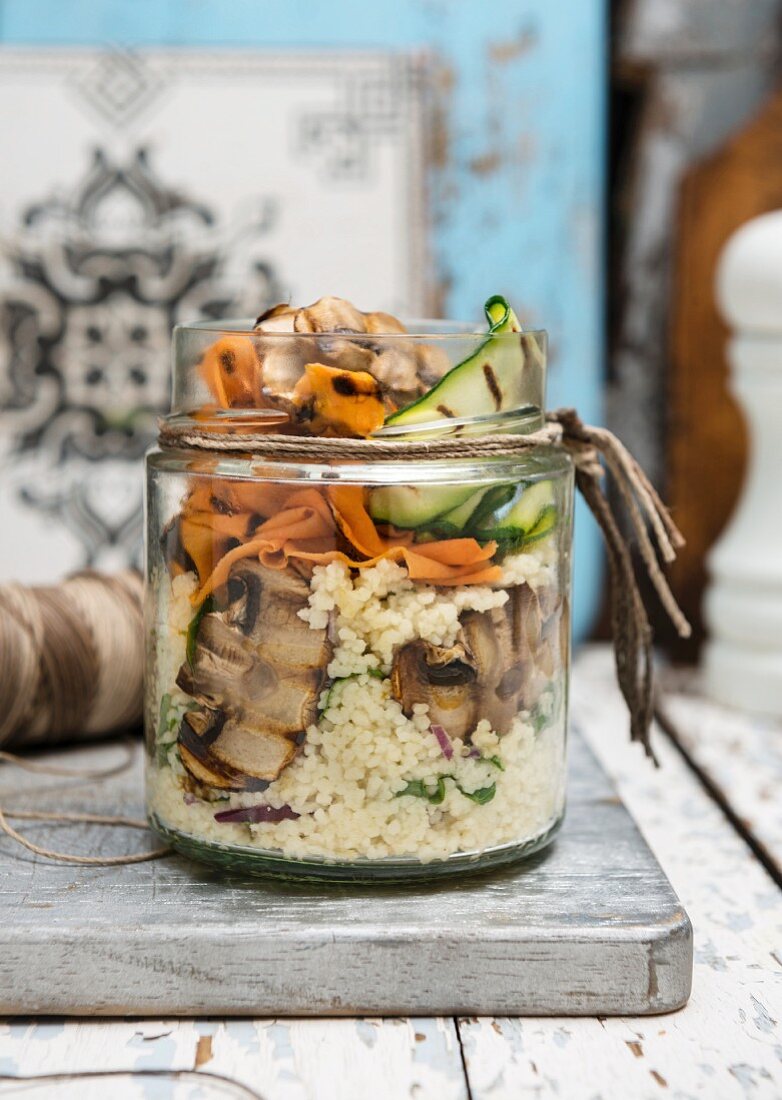 Vegan couscous and roasted vegetables in a jar