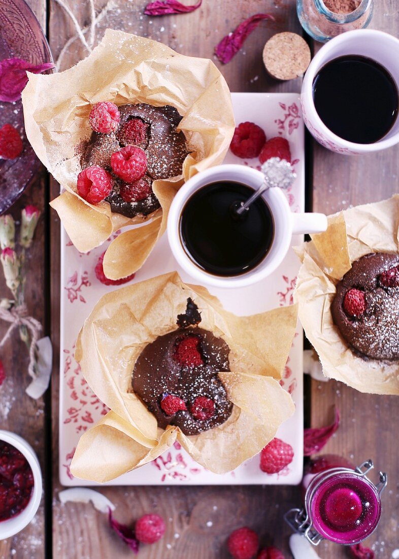 Chocolate Raspberry Muffins with coffee on a pink plate
