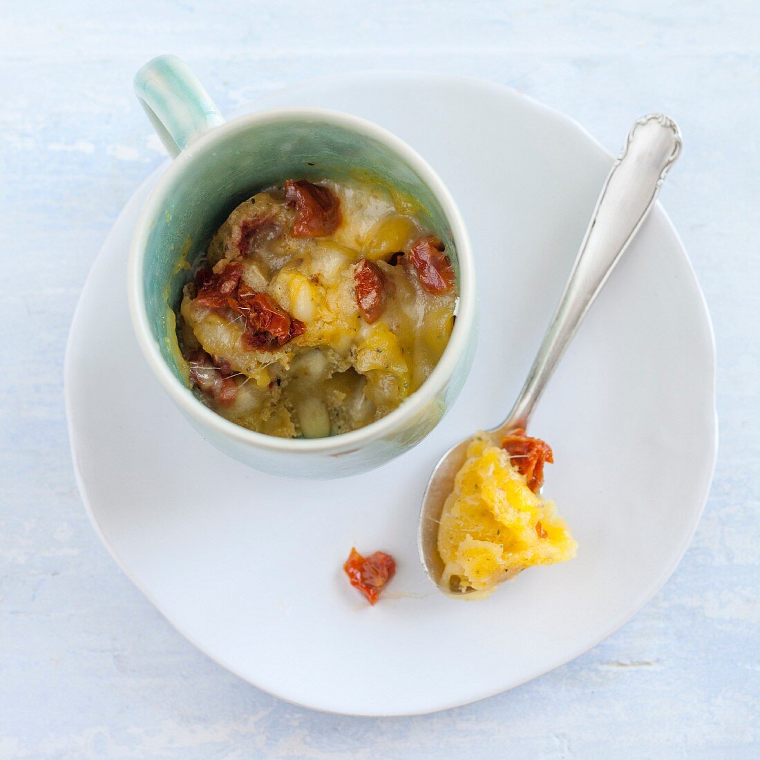 A savoury cupcake with cheese and dried tomatoes