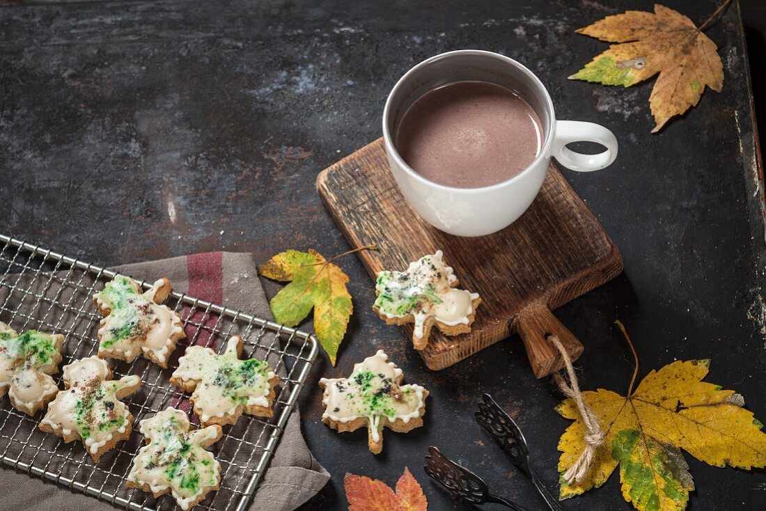Autumnal maple biscuits with maple syrup and a cup of hot chocolate