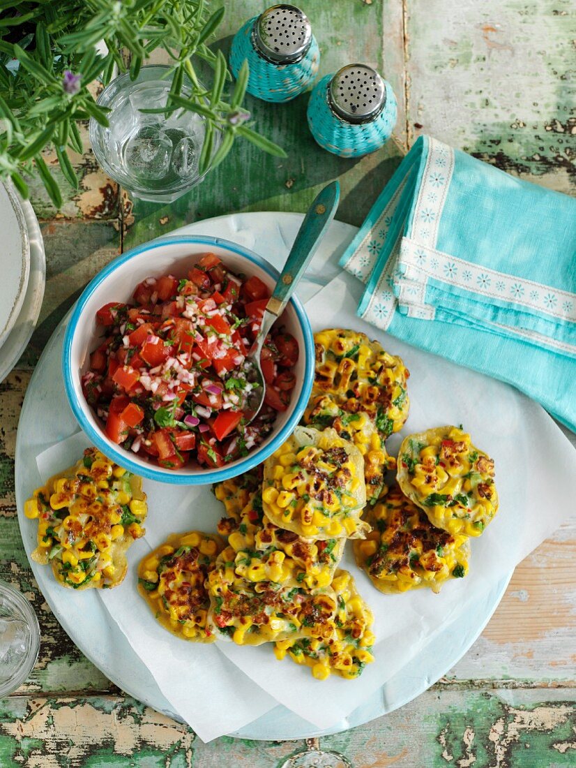 Corn cakes with herbs and tomato salsa