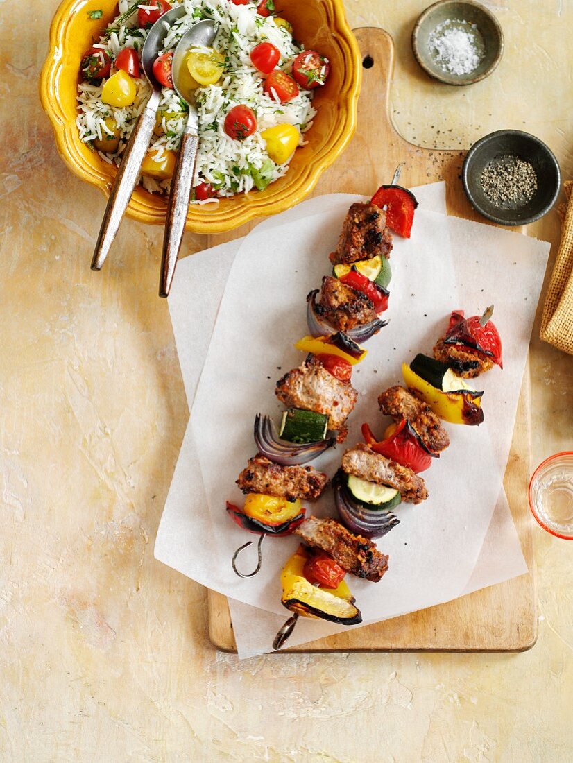 Lamb and vegetable kebabs with rice