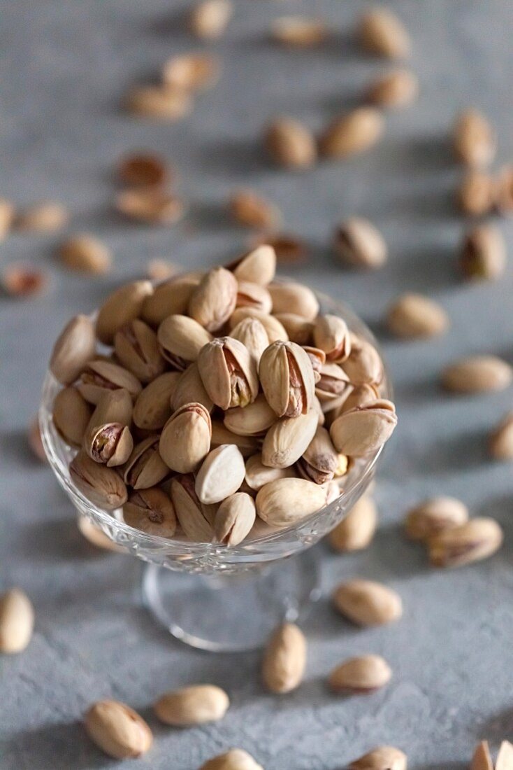 Pistachios in a crystal glass bowl