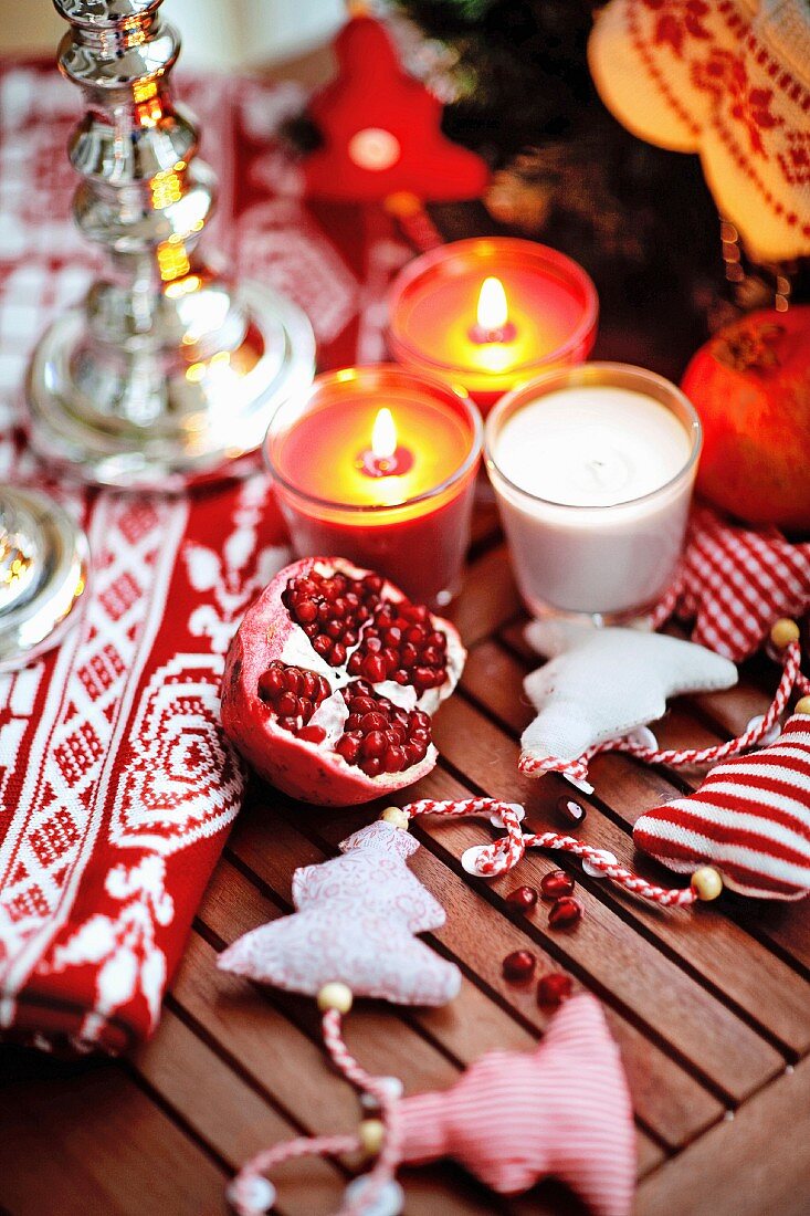 Pomegranate on a wooden table with Christmas decoration