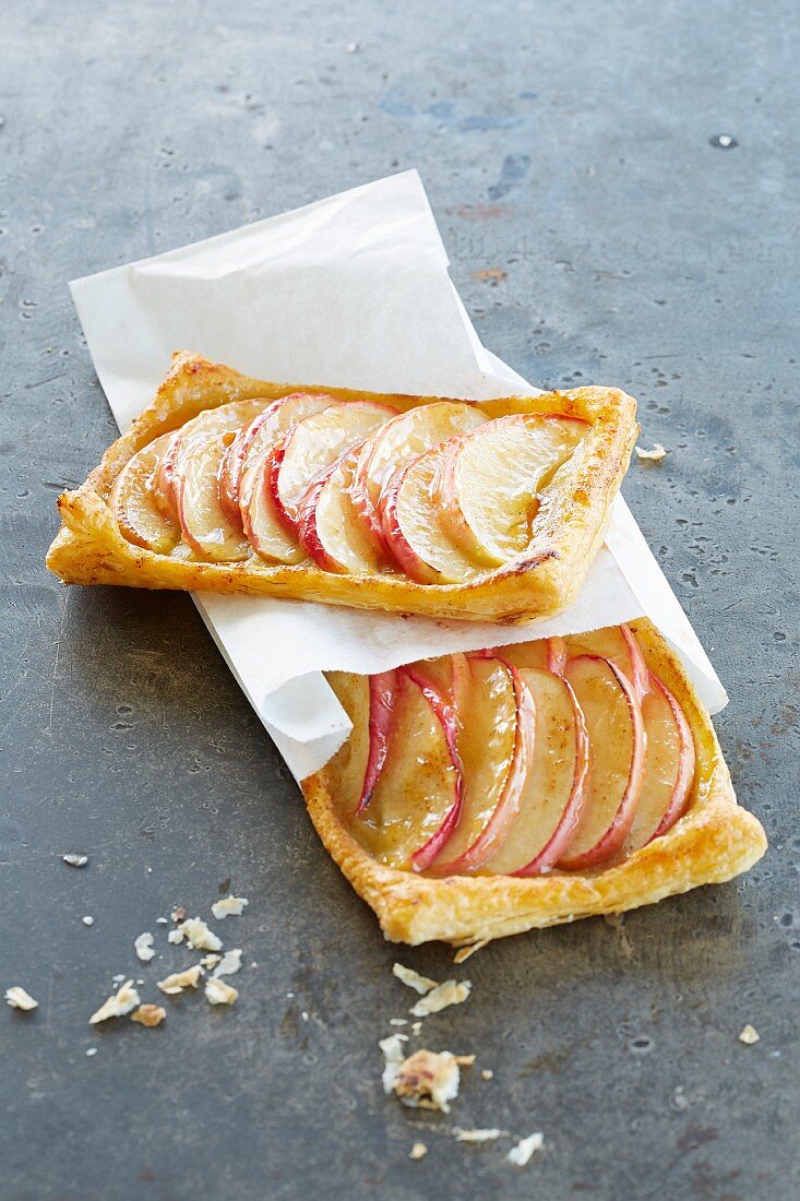 Small apple pastries in a paper bag
