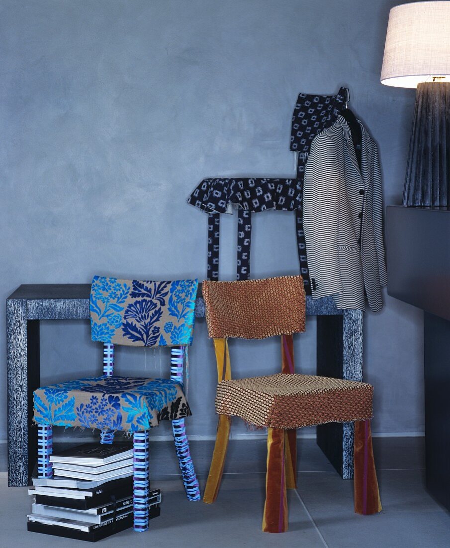 Chairs with hand-sewn covers made from various fabrics