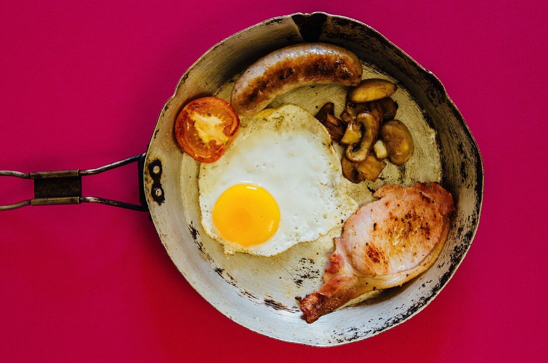 English cooked breakfast in an old frying pan
