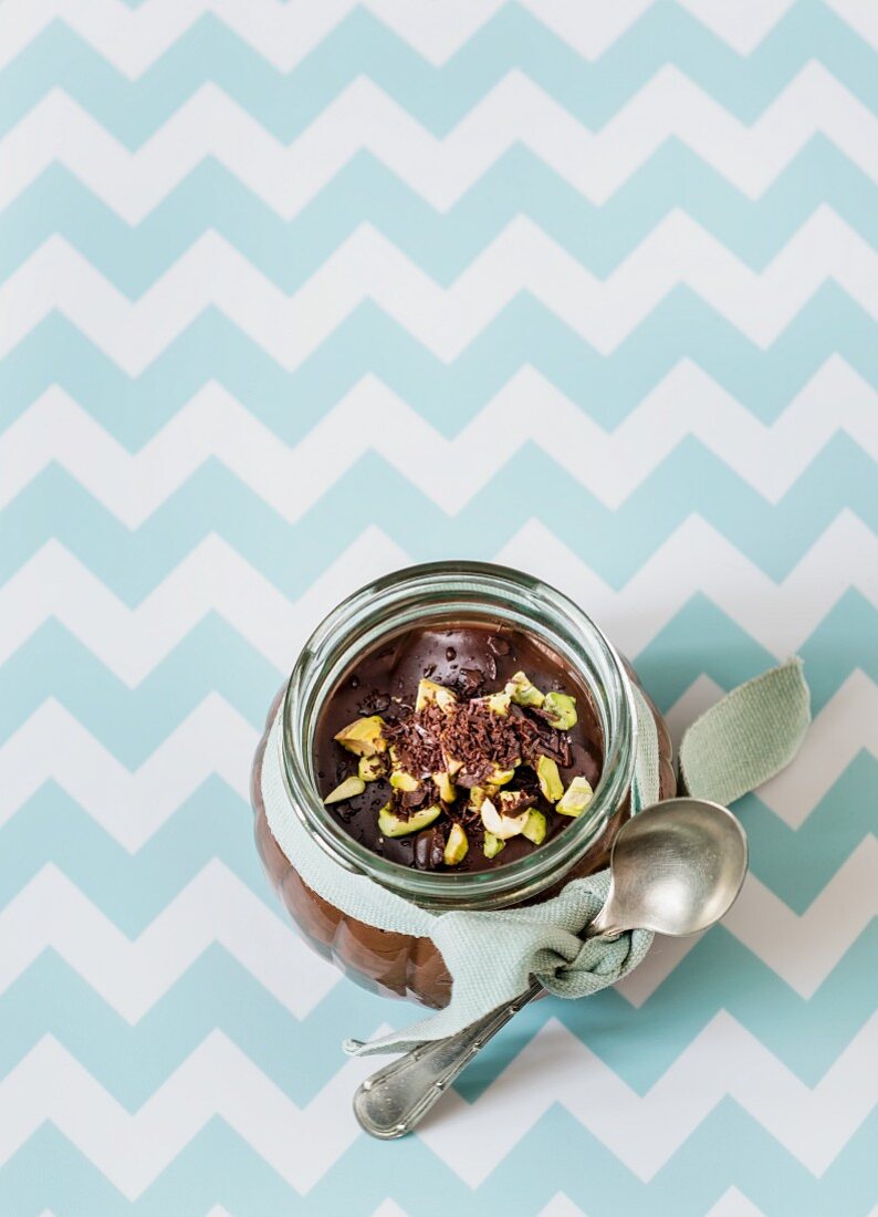 Chocolate pudding with pistachios in a glass