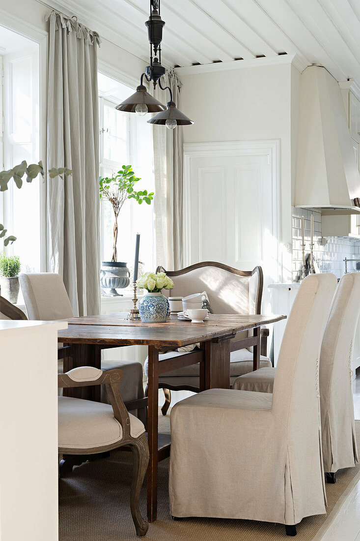 Elegant dining area in bright country-house kitchen