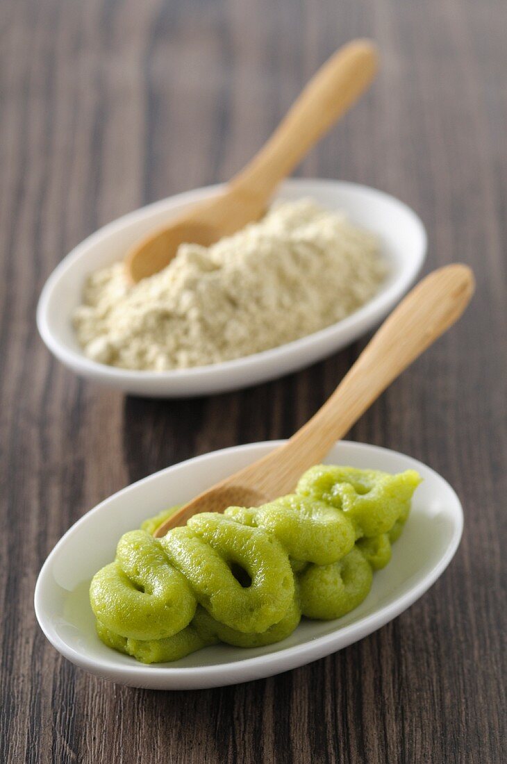 Wasabi with wooden spoons in small bowls