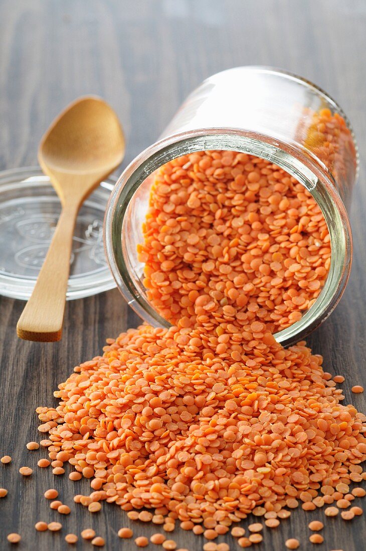An upset glass of red lentils