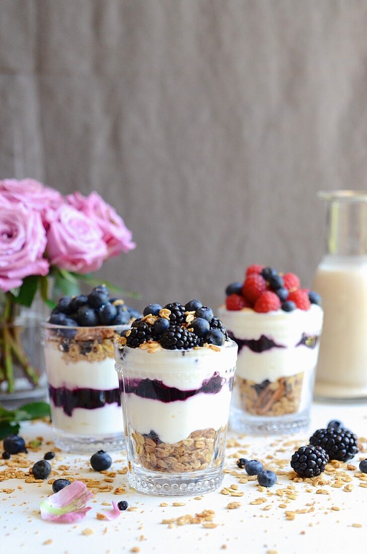 Chai latte granola with yogurt and berries in jars