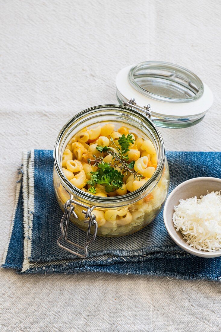 Horn pasta with a lentil ragout in a glass jar