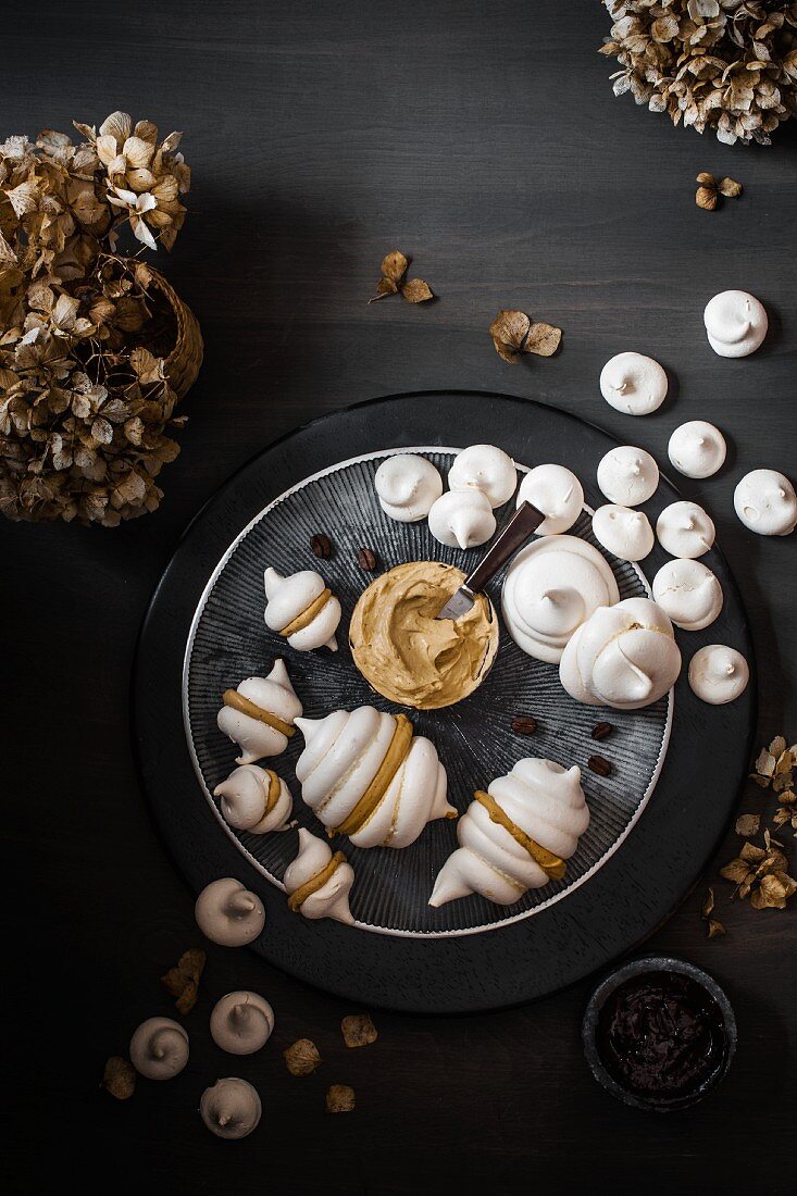 Meringues with coffee cream and dried flowers