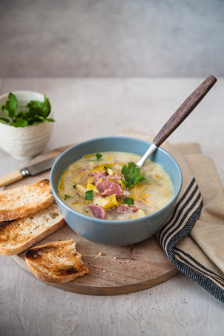 Leek and potato soup with ham and toast