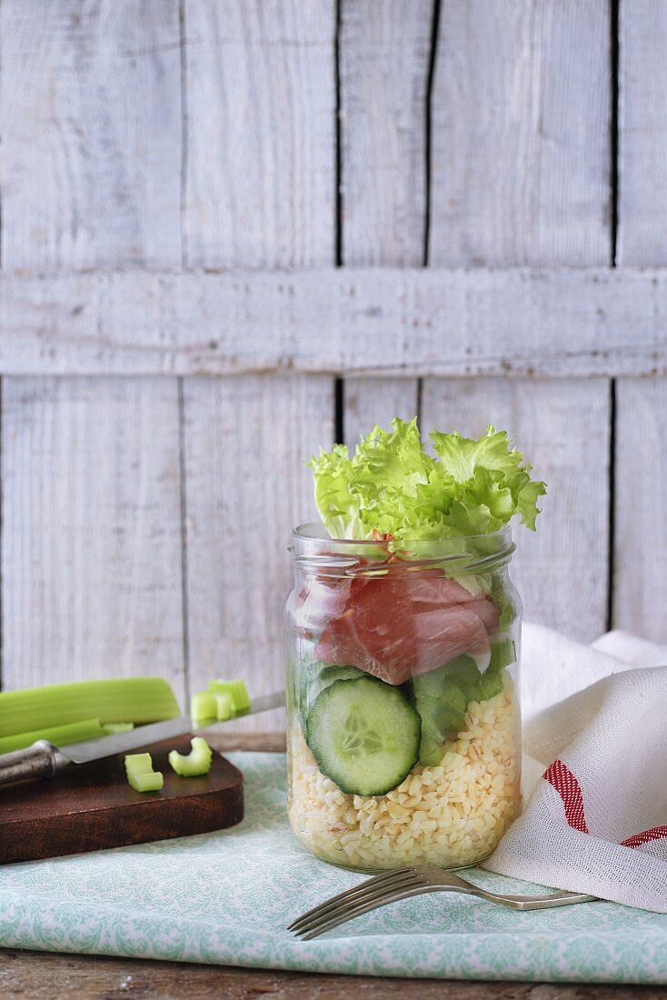 A spring bulgur wheat salad with cucumber, ham and celery
