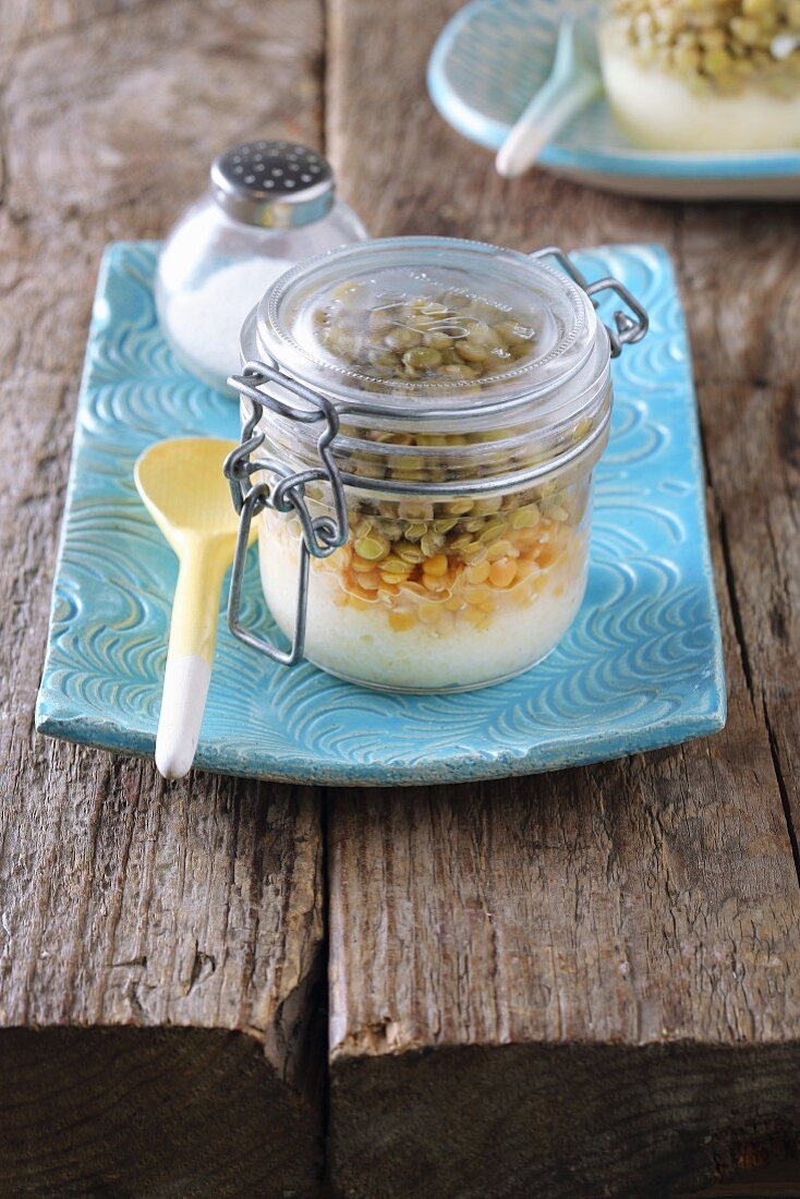 Lentil salad with celery cream in a glass jar