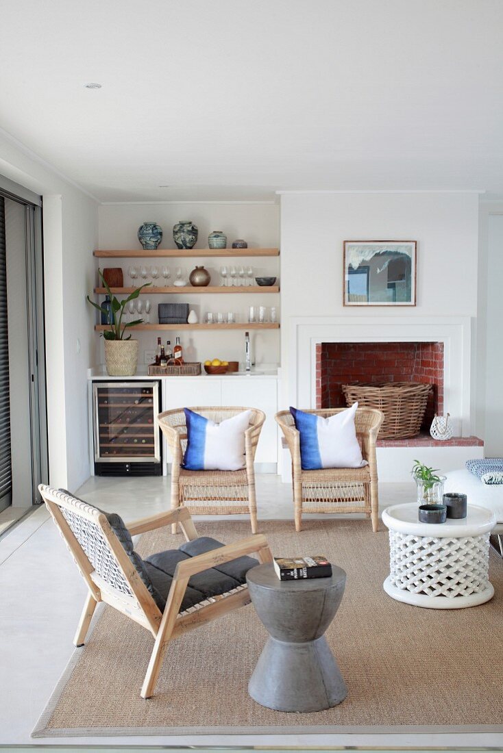 Fireplace and kitchen counter in open-plan living area of holiday home