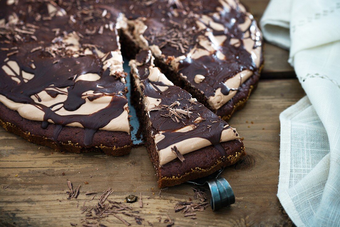 A chocolate tart with chocolate cream and dark chocolate frosting