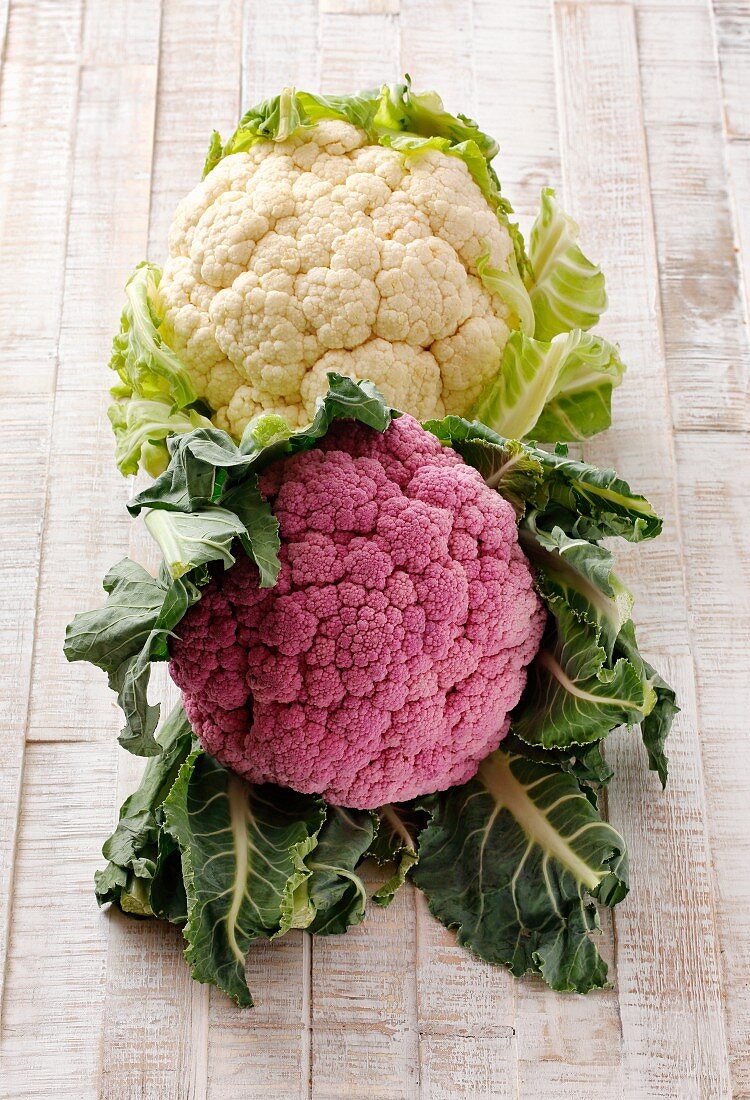 A cauliflower and a purple cauliflower