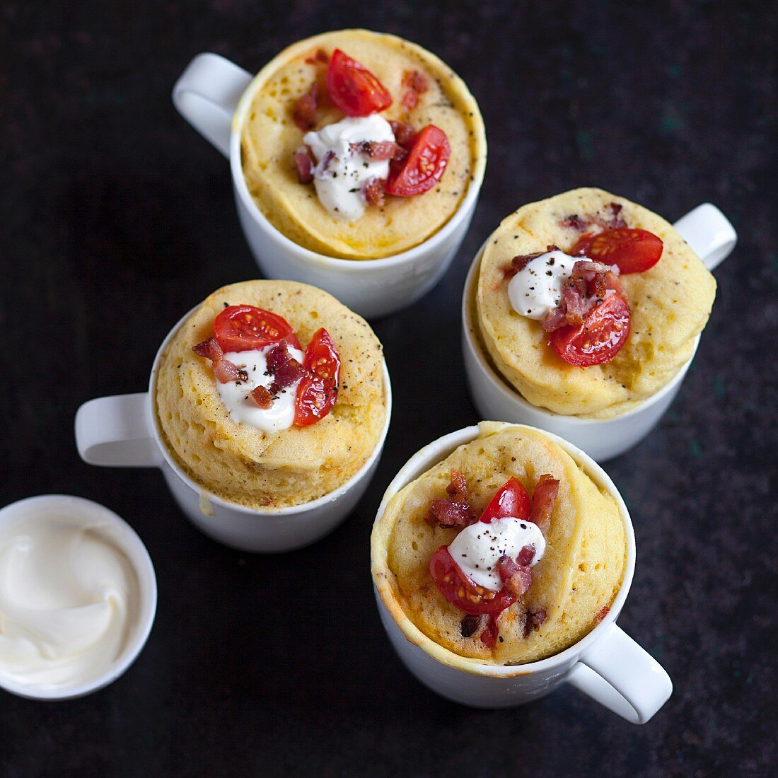 Savoury mug cakes with cherry tomatoes and bacon